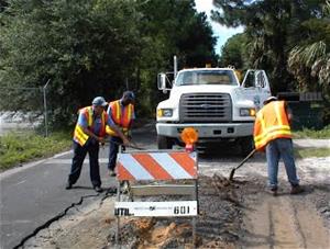Men working on a city street maintenance project